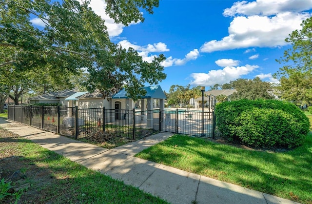 view of property's community with a yard