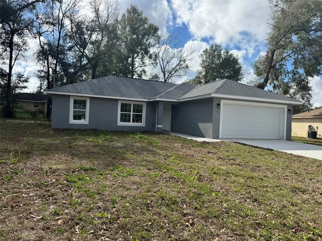 ranch-style house with a garage and a front yard