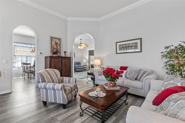 living room with hardwood / wood-style flooring and ornamental molding