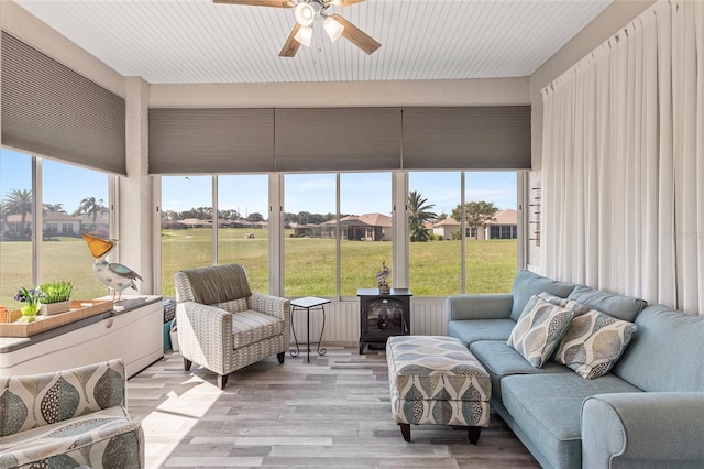 sunroom with plenty of natural light and ceiling fan