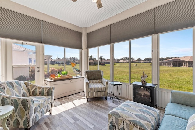 sunroom featuring ceiling fan