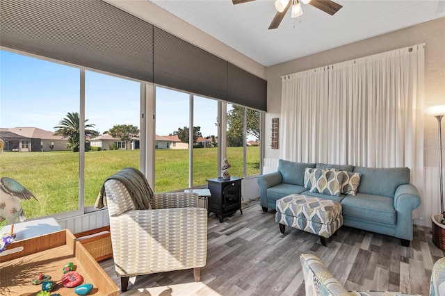 sunroom / solarium with ceiling fan