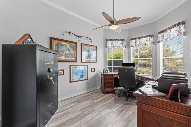 office space with ceiling fan, light hardwood / wood-style flooring, ornamental molding, and a healthy amount of sunlight