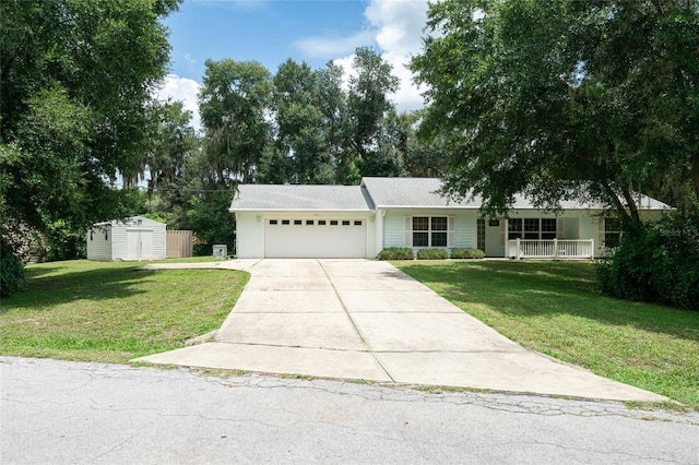 ranch-style home with a garage, covered porch, and a front yard