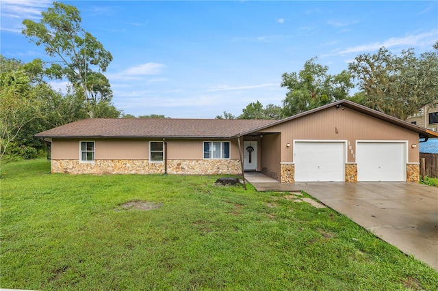 ranch-style home with a front yard and a garage