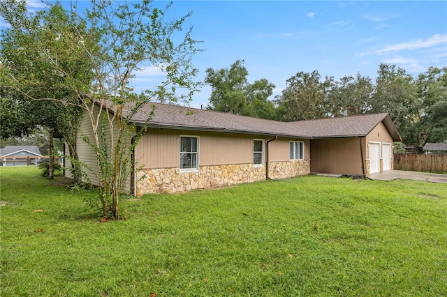 view of front of home featuring a garage and a front lawn