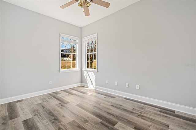 unfurnished room featuring light wood-type flooring and ceiling fan