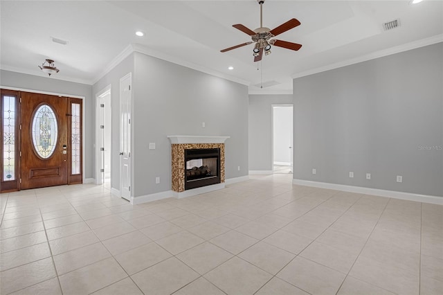 unfurnished living room featuring crown molding, light tile patterned floors, a multi sided fireplace, and ceiling fan