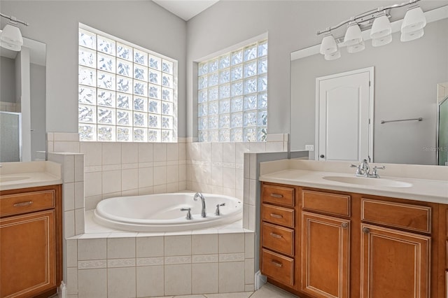 bathroom featuring vanity and plus walk in shower