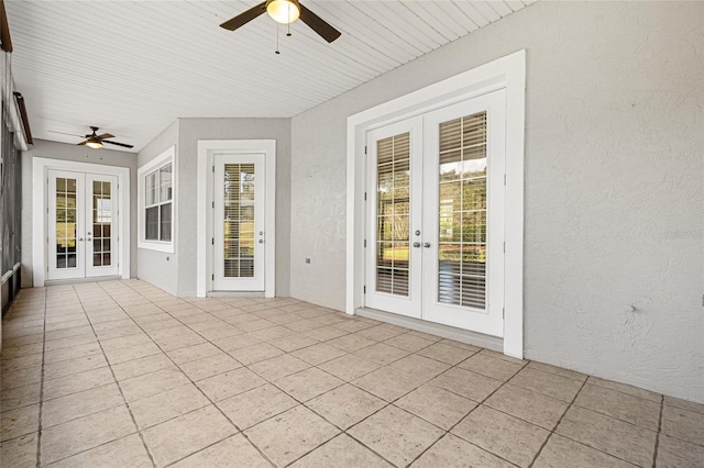 unfurnished sunroom with french doors, ceiling fan, and wooden ceiling