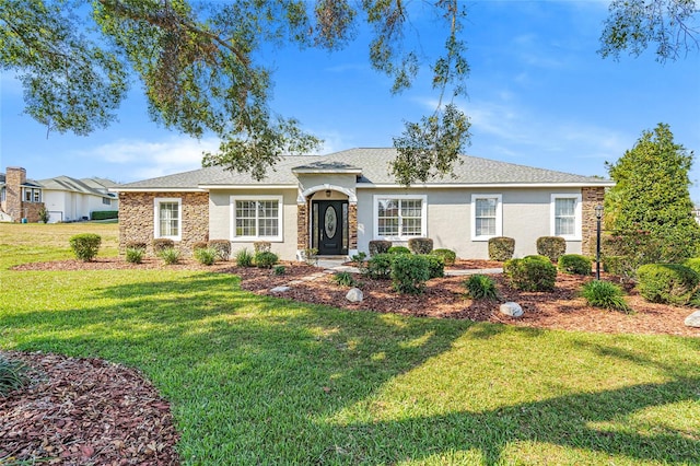 ranch-style house with a front lawn