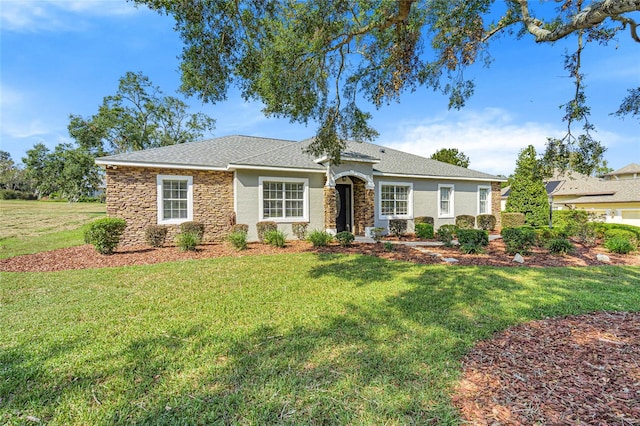 ranch-style home featuring a front yard