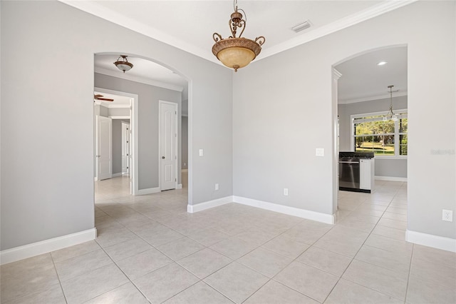 tiled empty room featuring crown molding and ceiling fan