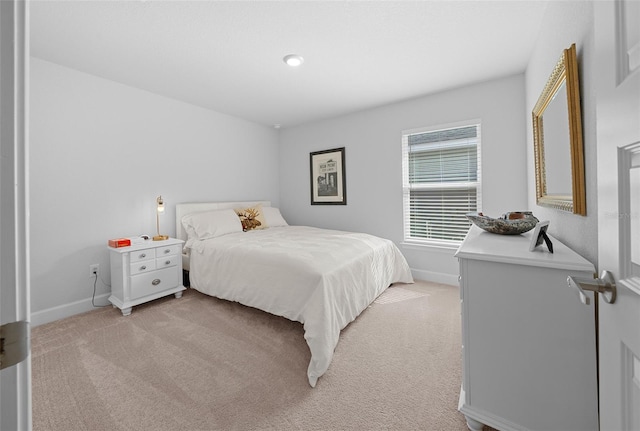 bedroom featuring light carpet