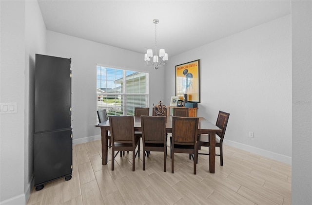 dining area featuring a chandelier