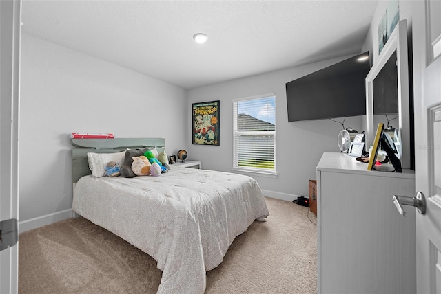 bedroom with light colored carpet