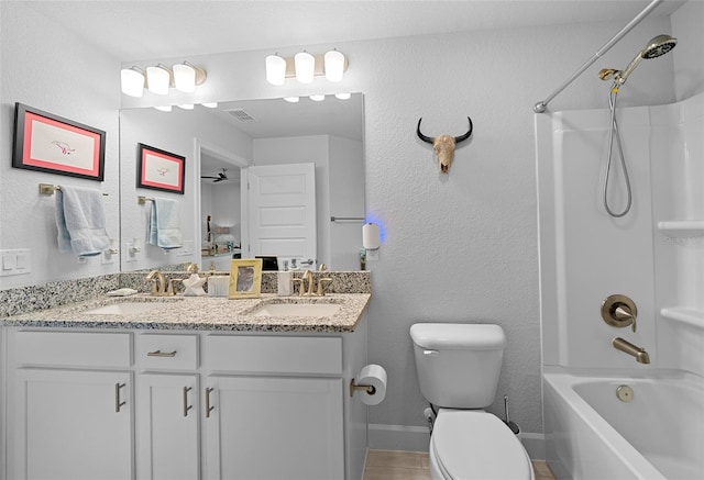 full bathroom with tile patterned floors, vanity, shower / bath combination, and toilet