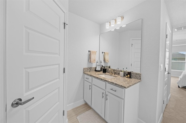 bathroom featuring vanity and a textured ceiling