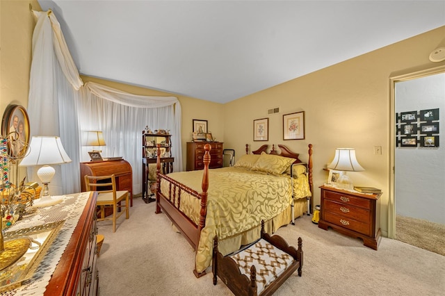 bedroom featuring light colored carpet