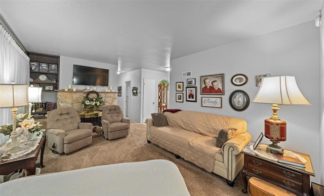 living room featuring carpet floors and a stone fireplace