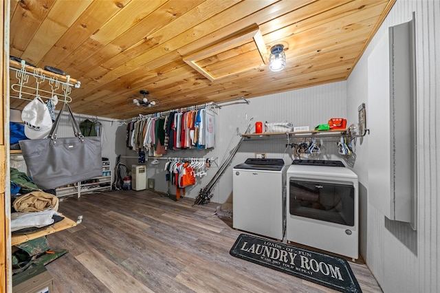 laundry area featuring wooden ceiling, hardwood / wood-style flooring, and independent washer and dryer