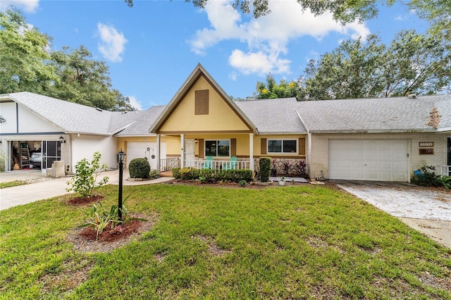 ranch-style home with a porch, a garage, and a front yard