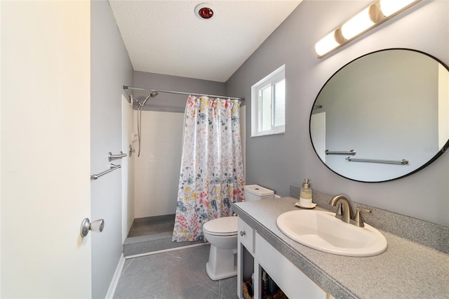 bathroom featuring tile patterned flooring, a textured ceiling, walk in shower, vanity, and toilet