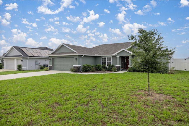 ranch-style home featuring a front yard and a garage