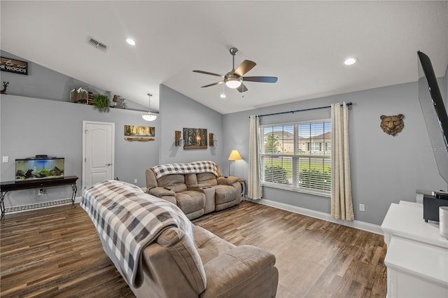 living room featuring lofted ceiling, ceiling fan, and dark wood-type flooring