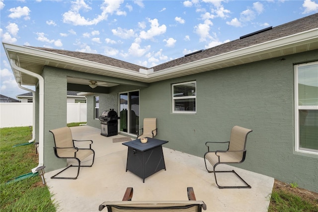 view of patio with area for grilling and ceiling fan