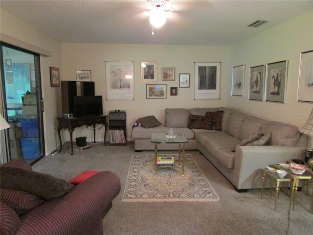 living room featuring light colored carpet and ceiling fan