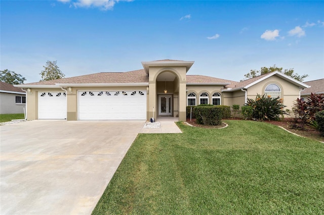 view of front facade featuring a front yard and a garage