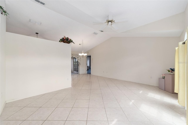 unfurnished room with ceiling fan with notable chandelier, lofted ceiling, and light tile patterned floors