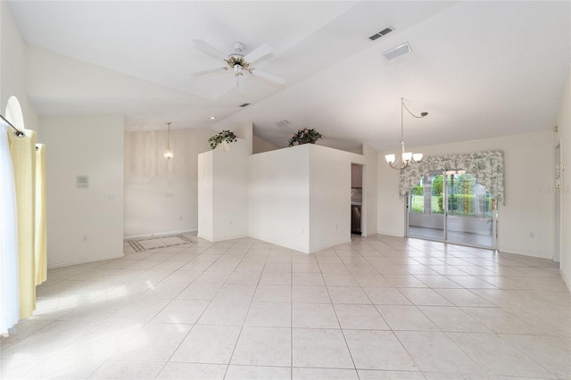 empty room featuring ceiling fan with notable chandelier, lofted ceiling, and light tile patterned flooring