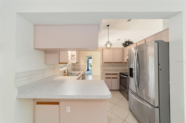 kitchen with backsplash, kitchen peninsula, pendant lighting, stainless steel appliances, and sink