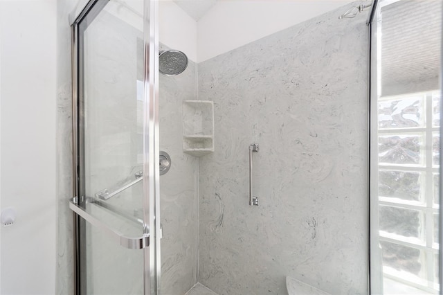 bathroom featuring an enclosed shower