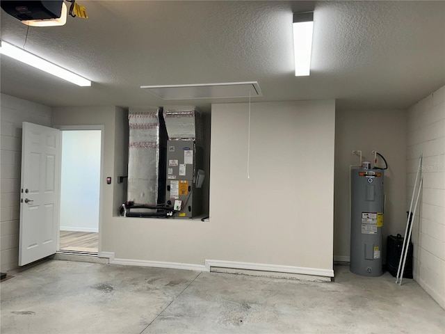 garage featuring water heater, heating unit, concrete block wall, and a garage door opener