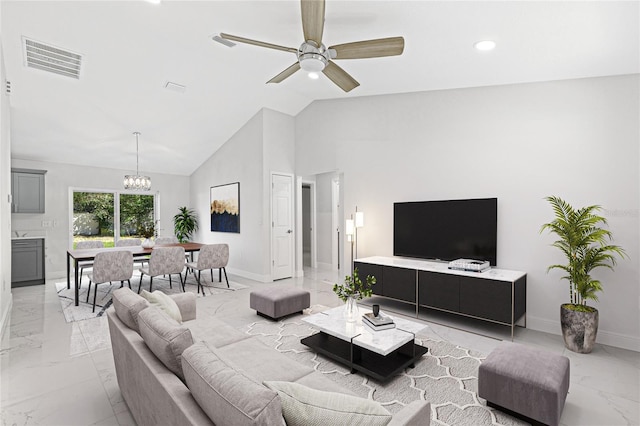 living room featuring vaulted ceiling and ceiling fan with notable chandelier