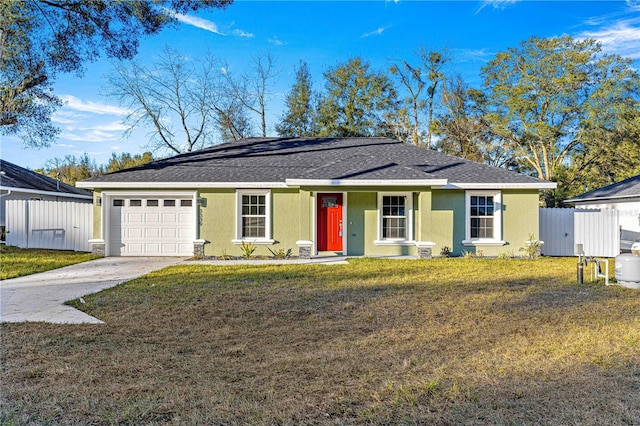 ranch-style house featuring a front yard and a garage