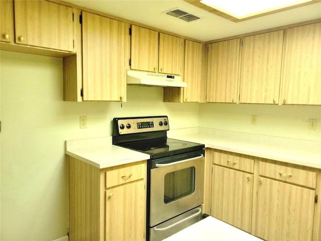 kitchen featuring stainless steel range with electric stovetop and light brown cabinets