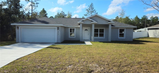 ranch-style home with a front yard and a garage