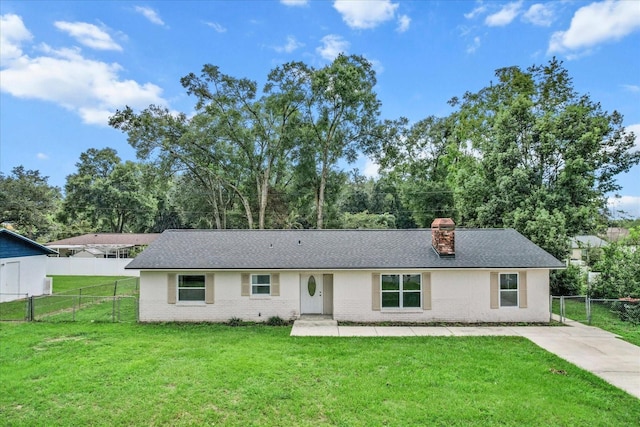 ranch-style house with a front yard