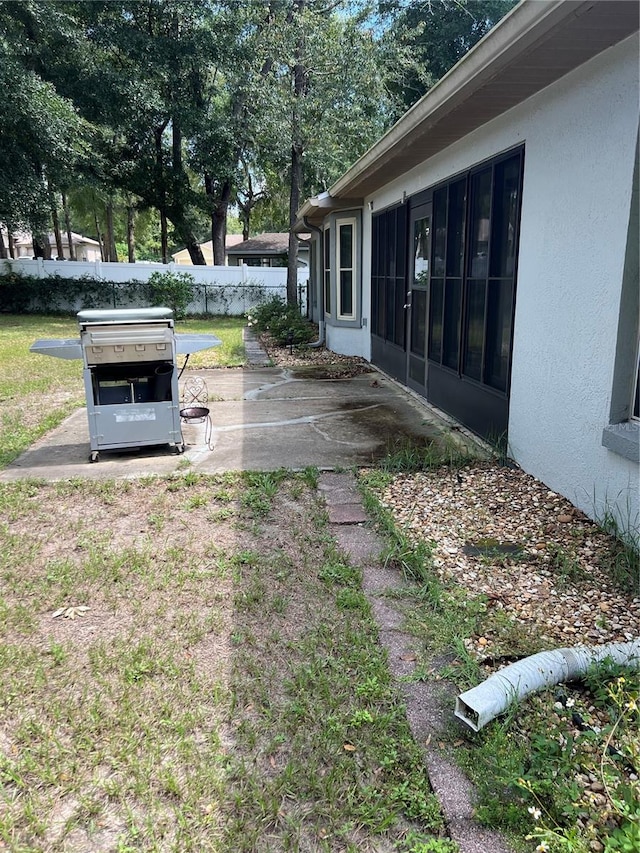 view of yard featuring a sunroom