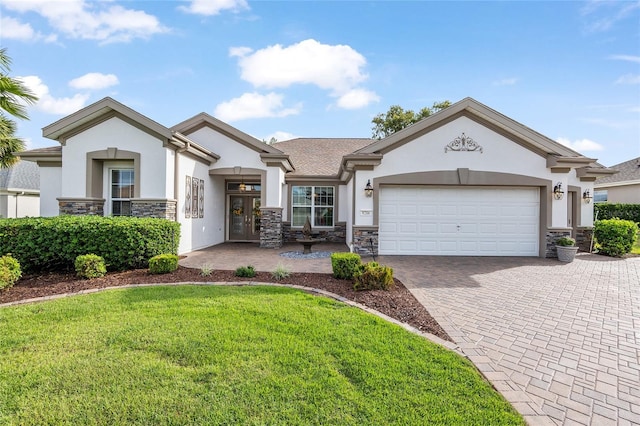 view of front of house with a garage and a front lawn