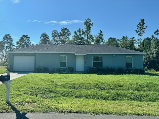 single story home featuring a garage and a front lawn