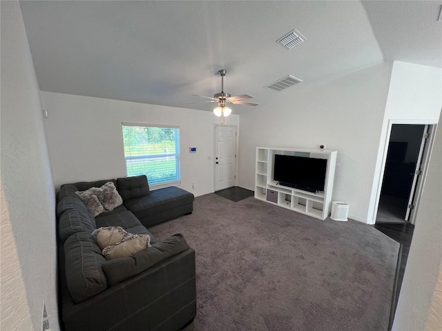 carpeted living room with ceiling fan and lofted ceiling