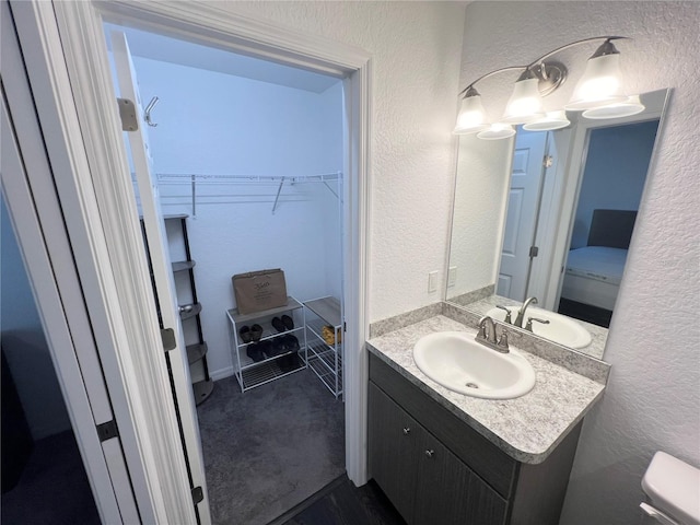 bathroom with vanity and toilet