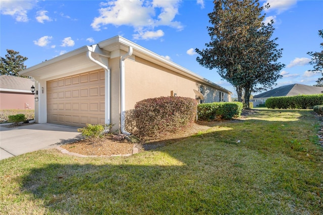 view of property exterior with a garage and a yard