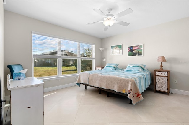 bedroom featuring ceiling fan and light tile patterned flooring