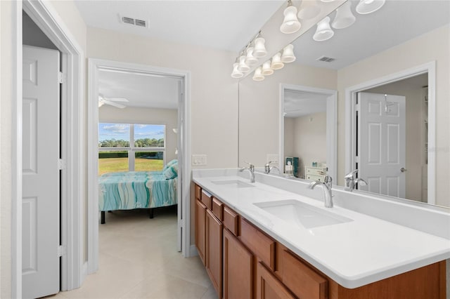 bathroom with tile patterned floors, ceiling fan, and vanity